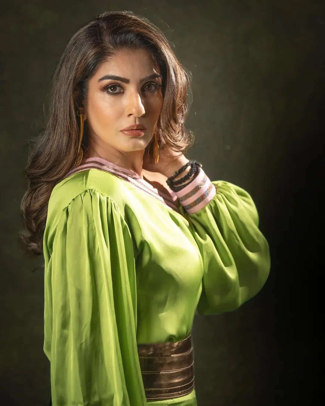 RAVEENA TANDON STILLS IN GREEN GOWN